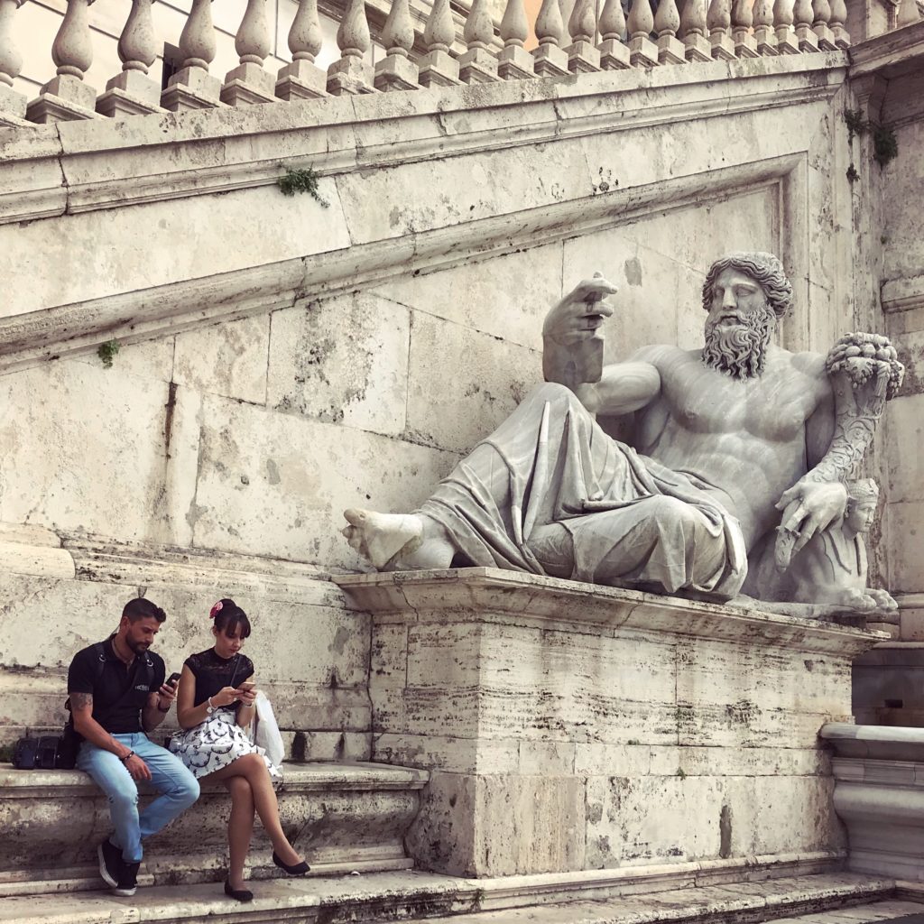 travel Romans staring at phones