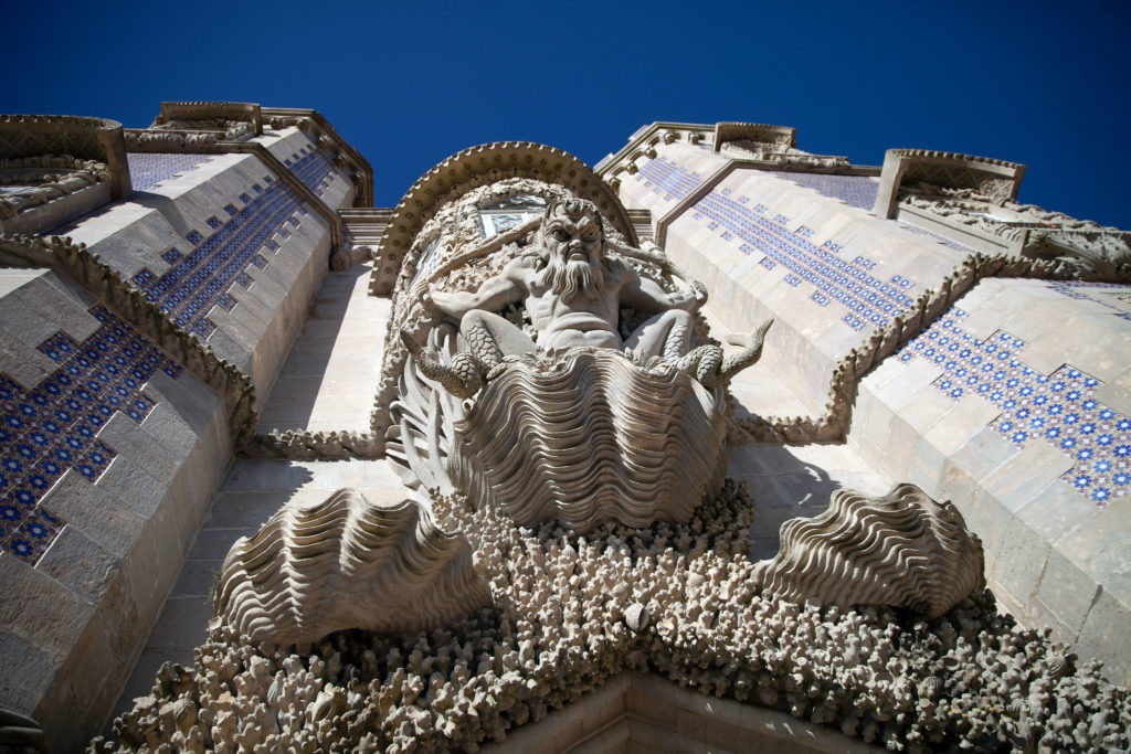 View from below of a sea god on the side of Pena Palace