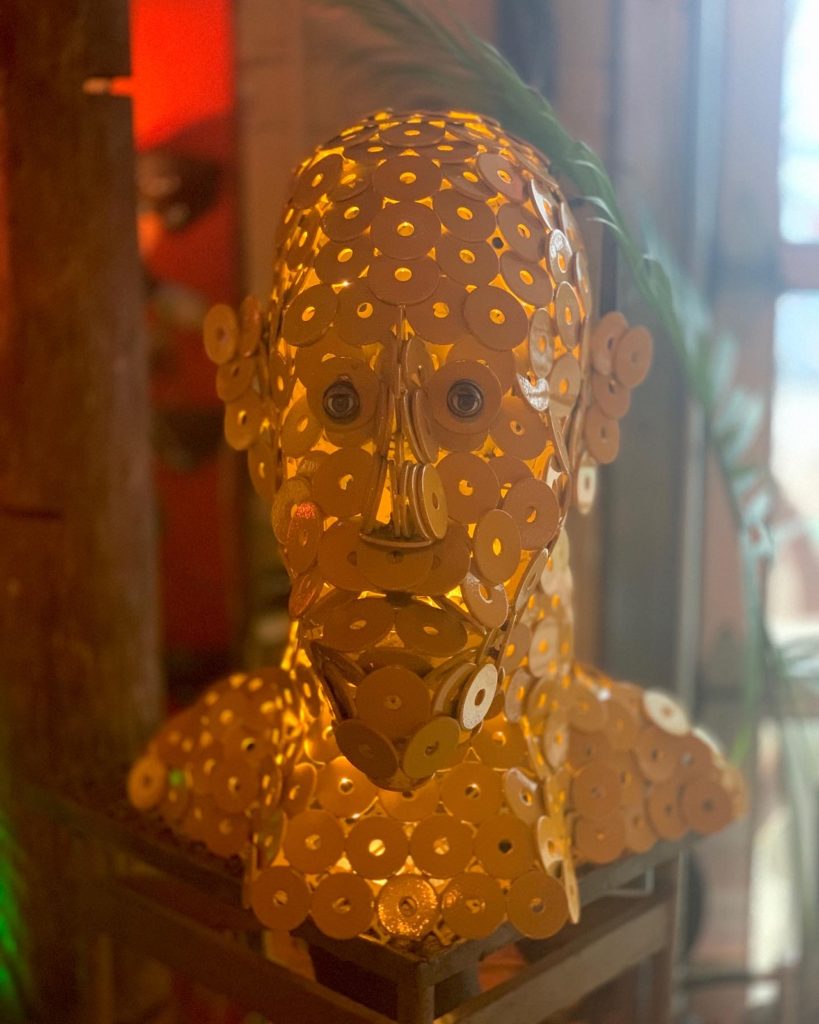 Bust made out of small yellow discs