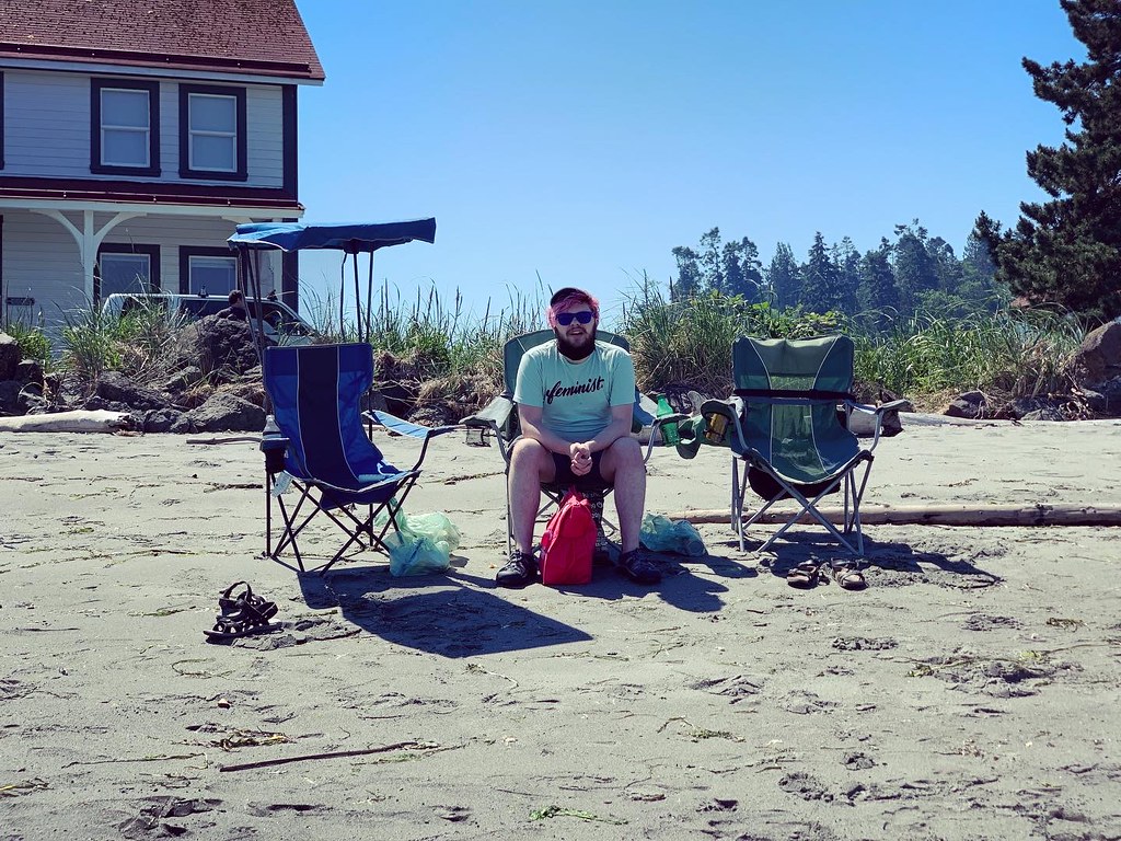 My son sitting on a beach chair at the beach near Useless Bay