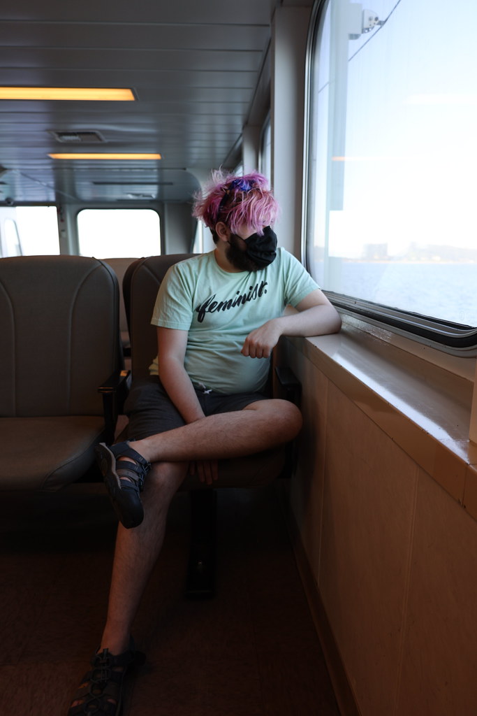 My son, wearing a mask, as we take the ferry from Seattle to Bremerton