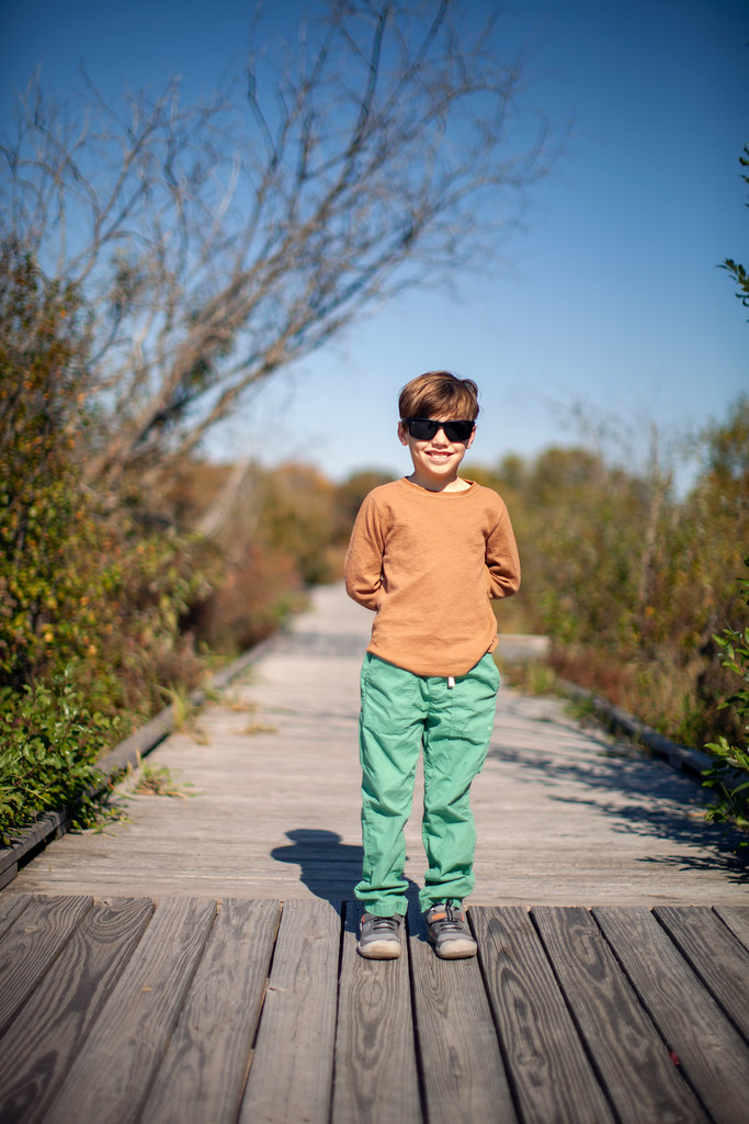 The newest addition to the family, a young boy in sunglasses